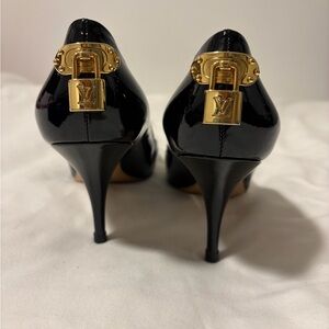 Louis Vuitton Black Heels with Gold Lock Detail